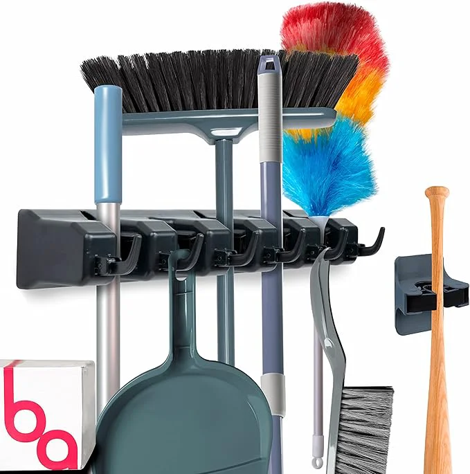 Proven Combo 5 Slot Broom Holder w 1 Self Adhesive Mop Gripper No-Drilling Wall Mount Tool Organizers For Kitchen Garage Laundry Room- Anti-Slip Hanger For Brooms Mops Rakes Dustpans Black Black About ThisOverview Refined